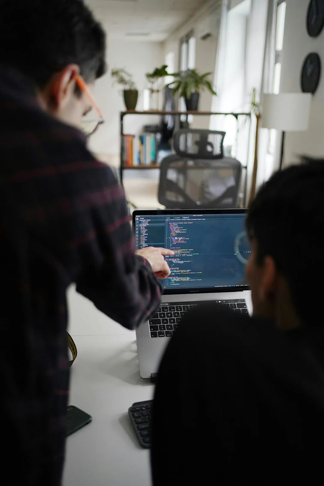 Overhead view of a diverse team collaborating on a project in a modern office setting.